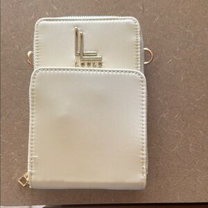Cream Mini Crossbody Bag. Perfect for travel or on the go ..